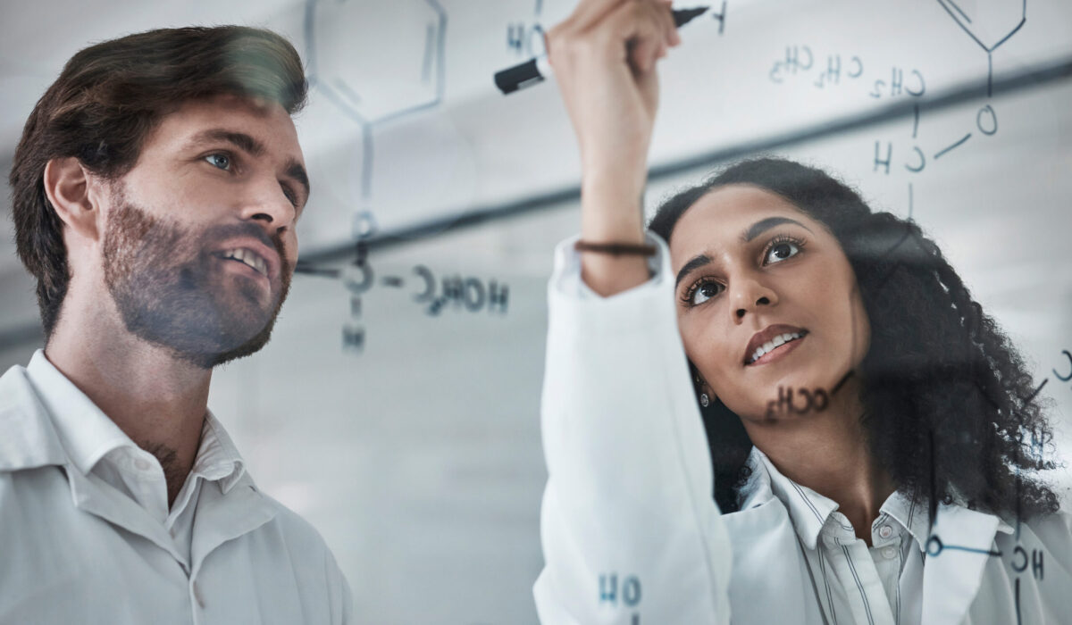 Teamwork, science and chemistry with people writing in laboratory for medicine, pharmacy or healthcare. Research, analytics and medical with scientists solving on glass board for idea, study or data.